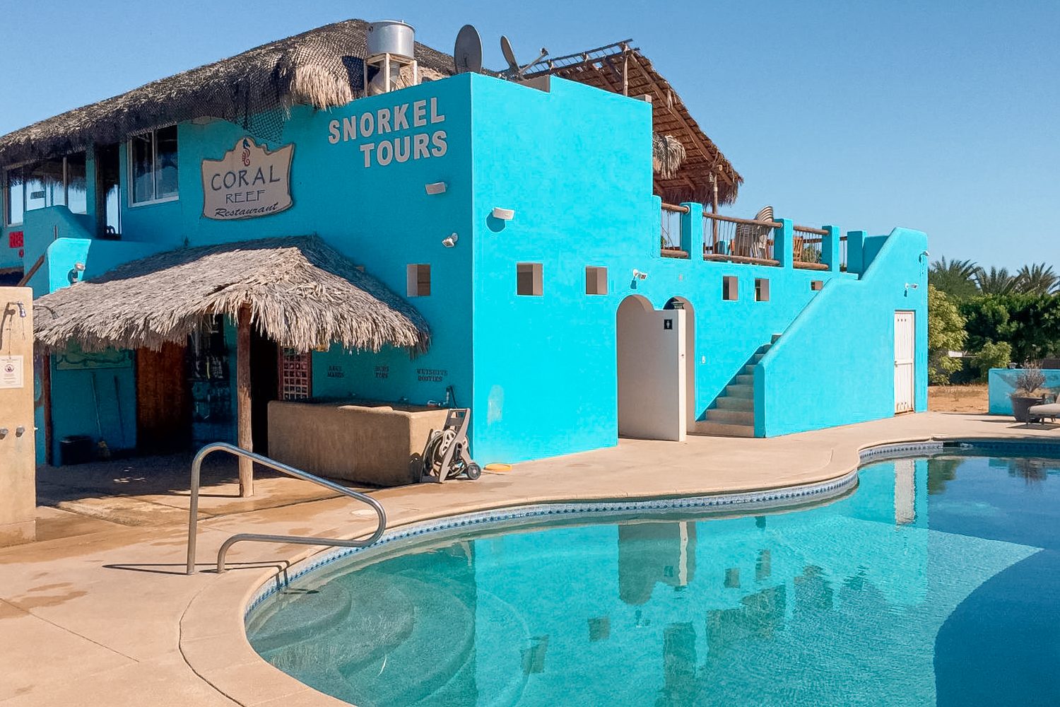 The two-story blue Cabo Pulmo Dive Center with its training pool and the Coral Reef Restaurant upstairs The two-story blue Cabo Pulmo Dive Center with its training pool and the Coral Reef Restaurant upstairs